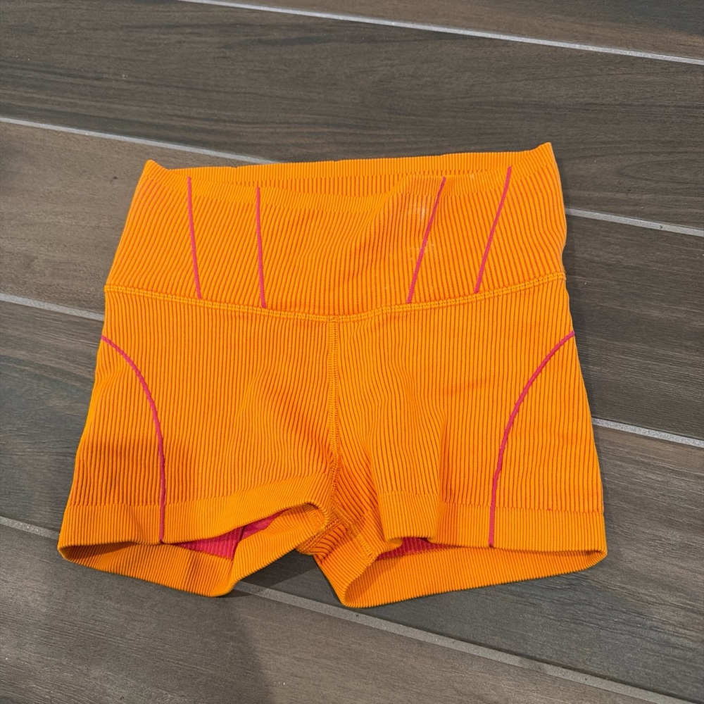 Vibrant Orange Bike Shorts with Pink Accents